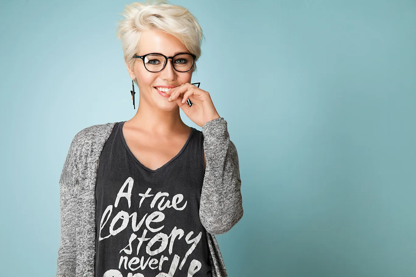 Smiling woman with short grey hair and glasses